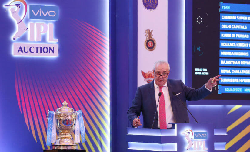 Hugh Edmeades the auctioneer for the 2022 IPL Auction, falls on stage.