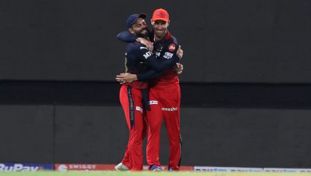 During an IPL match, Virat and Faf exchange a warm embrace.