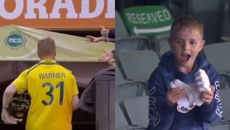 David Warner, the Australia opener, gives young people his batting gloves at the MCG after breaking his century-death drought.