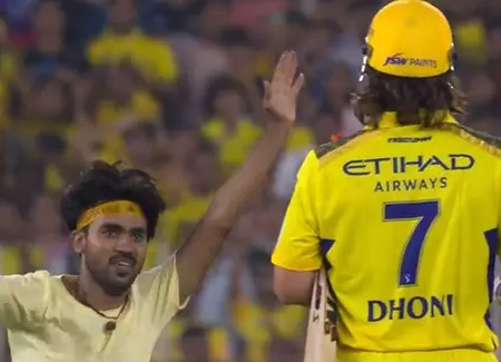 A fan invades the field to greet MS Dhoni during the GT versus CSK match